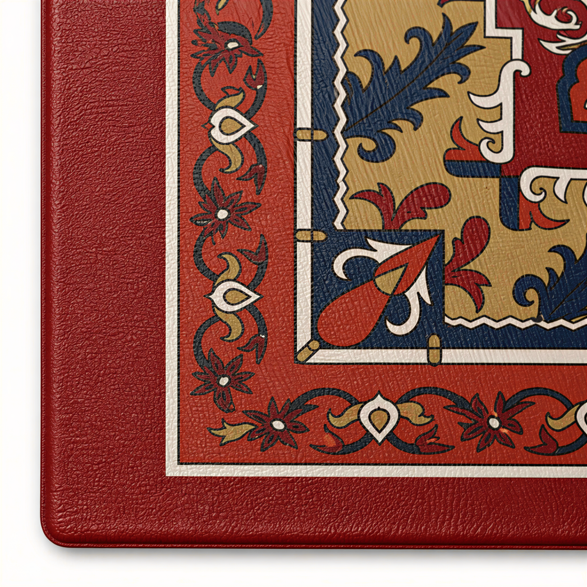 Close view of the corner of the rug design in red, navy, gold and cream