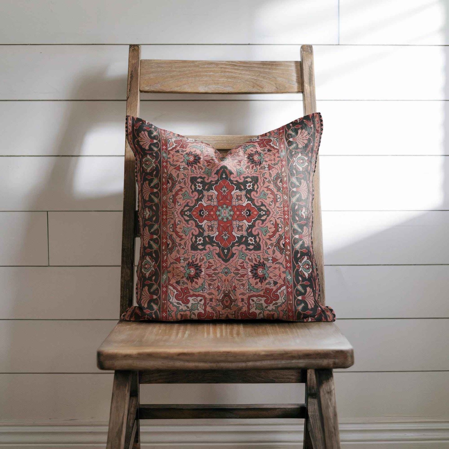 Anatolian Inspired throw pillow with rug-style pattern styled on a sofa or bed