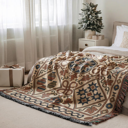 Rust and teal geometric throw over a bed beside a small Christmas tree and wrapped gifts