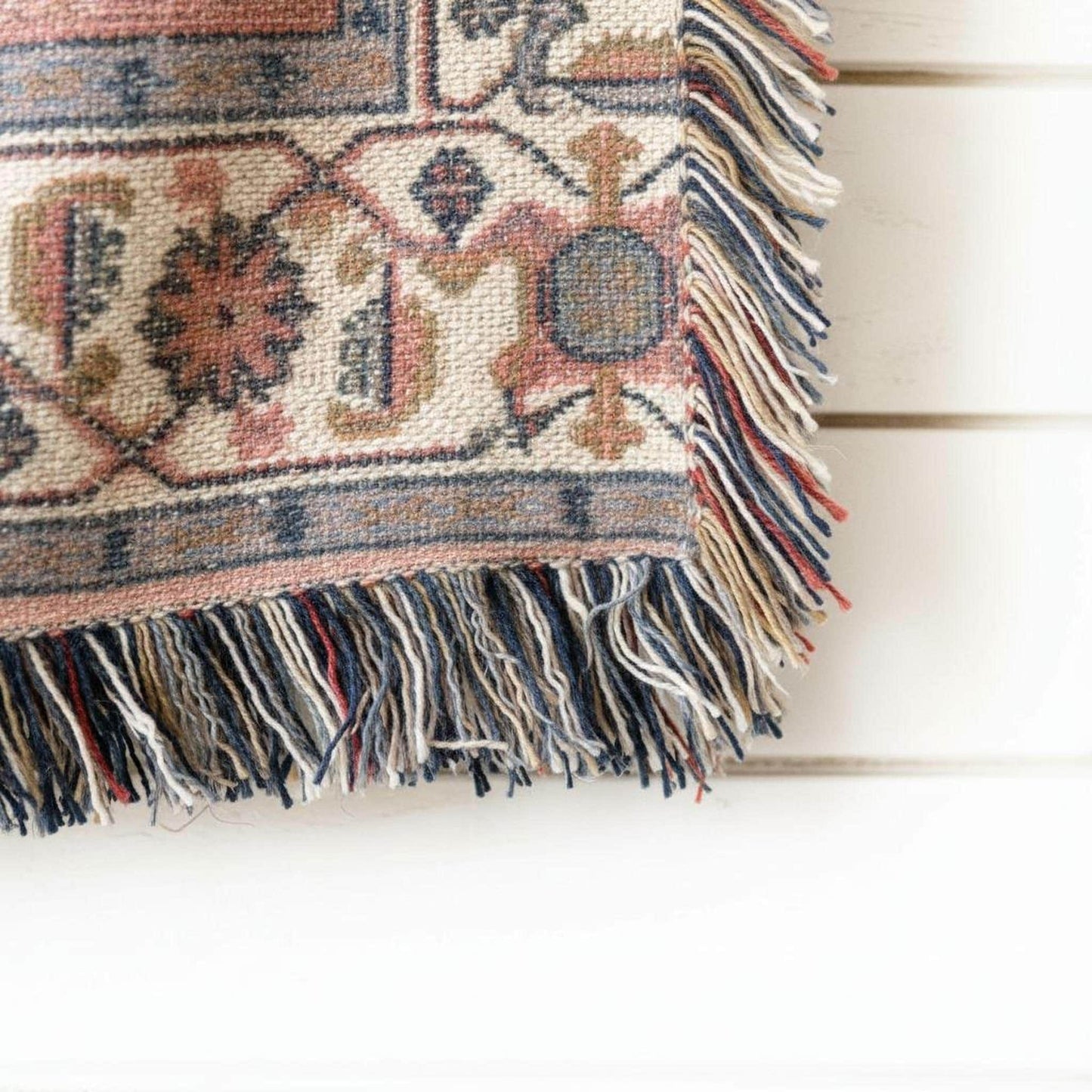 Caucasian Rug Inspired woven wall tapestry with geometric pattern styled as textile wall decor