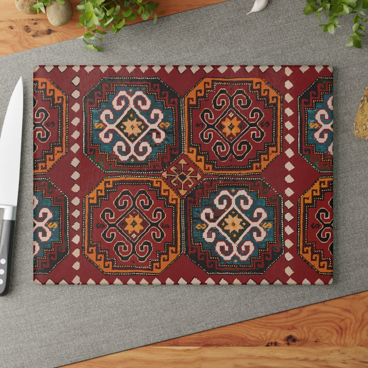 Armenian rug glass cutting board with octagonal medallions in red, gold and teal