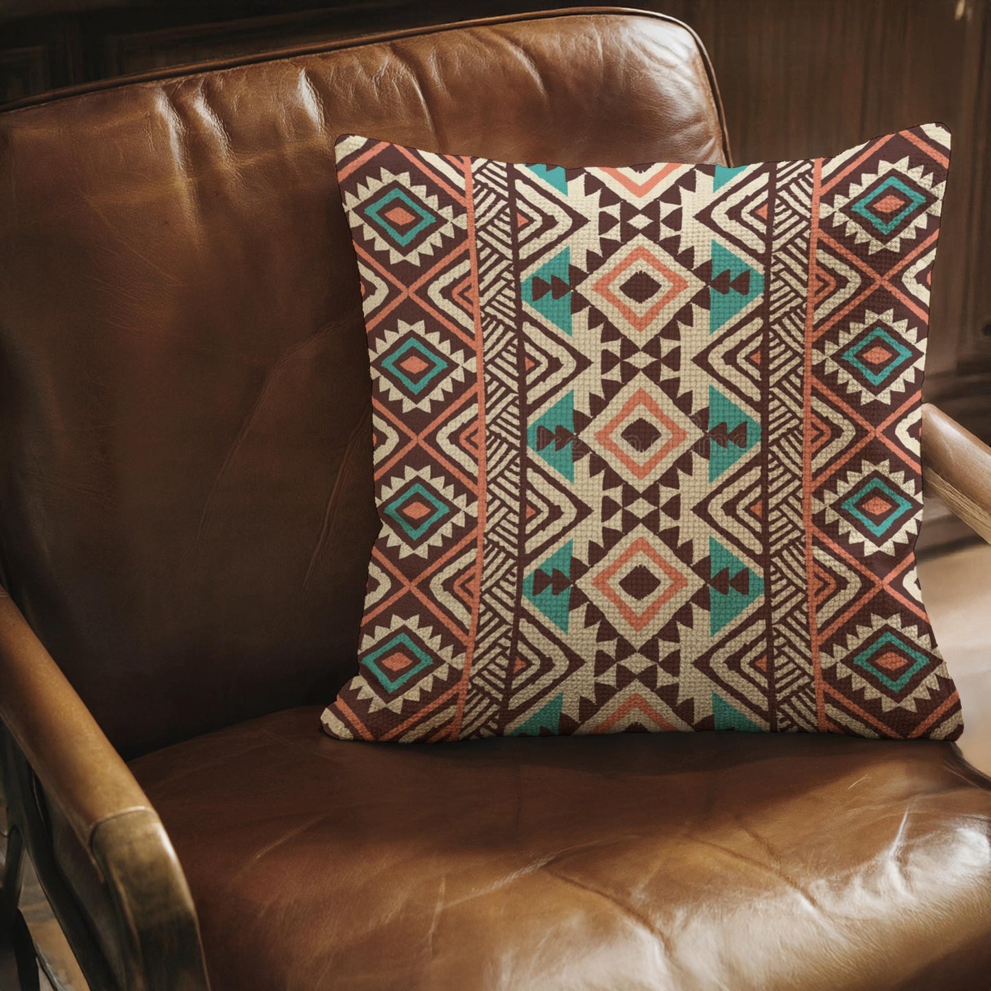 Southwestern pillow cover with geometric pattern styled on a sofa or bed
