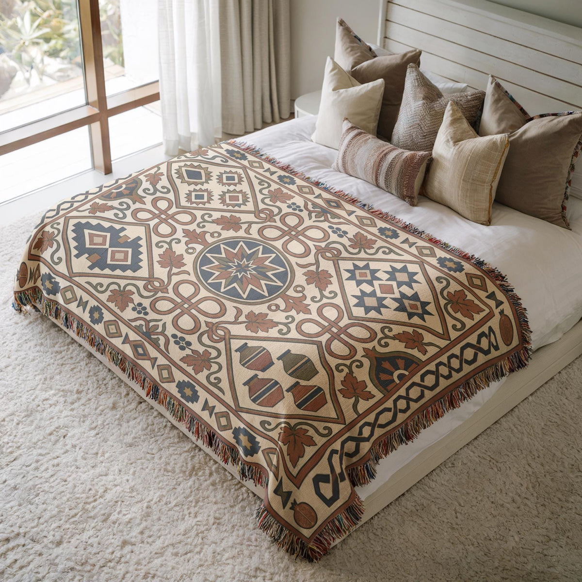 Rust and teal geometric woven cotton throw blanket with fringed edges