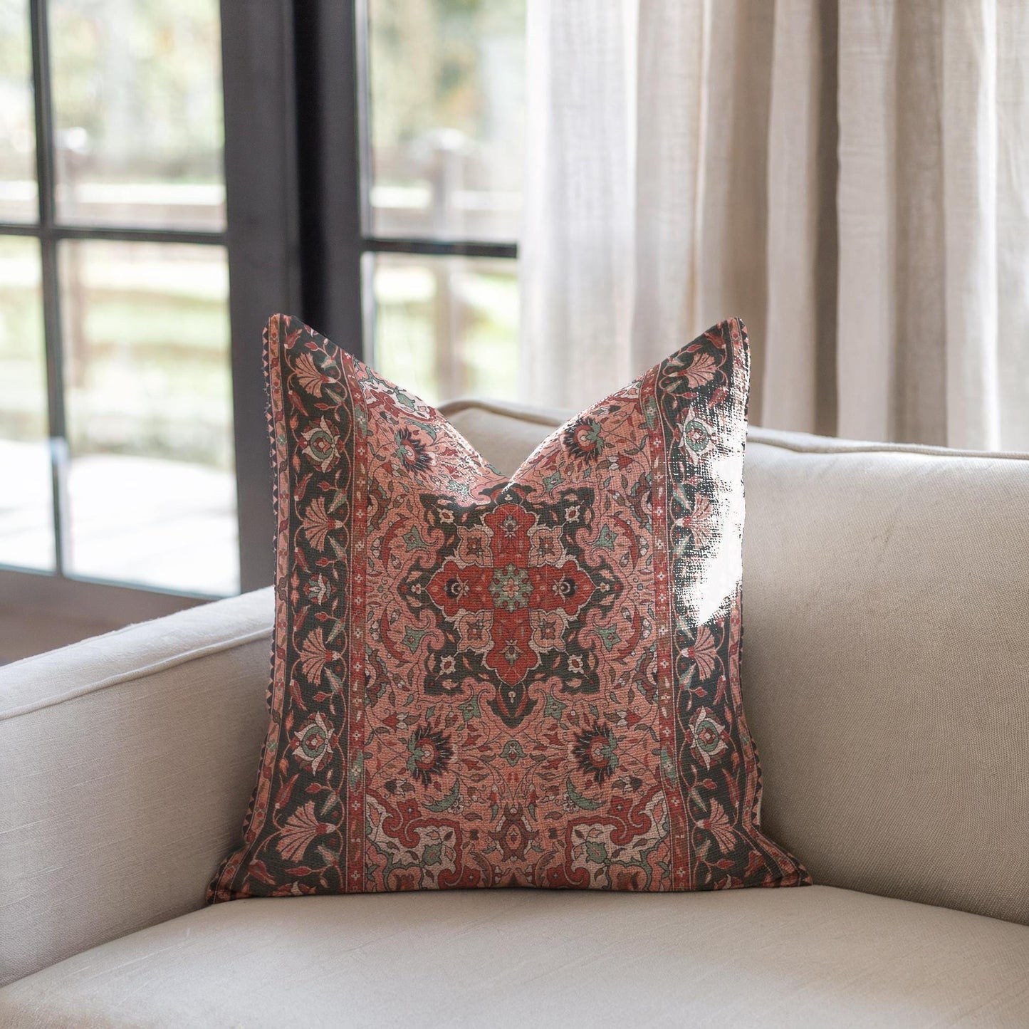 Anatolian Inspired throw pillow with rug-style pattern styled on a sofa or bed