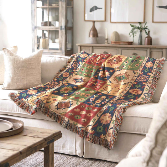 Anatolian Inspired woven blanket with floral pattern styled for layered home decor