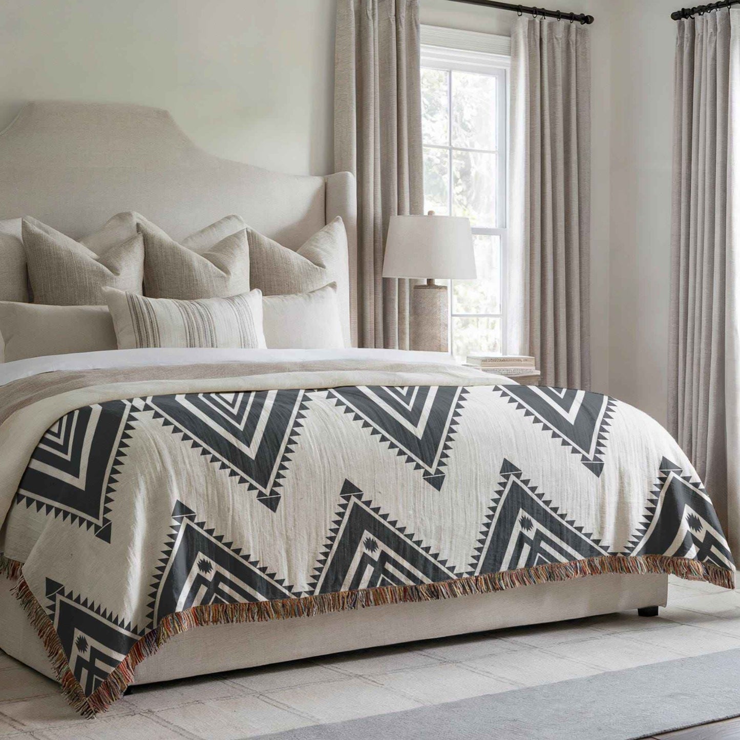 Southwestern woven blanket with geometric pattern styled for layered home decor