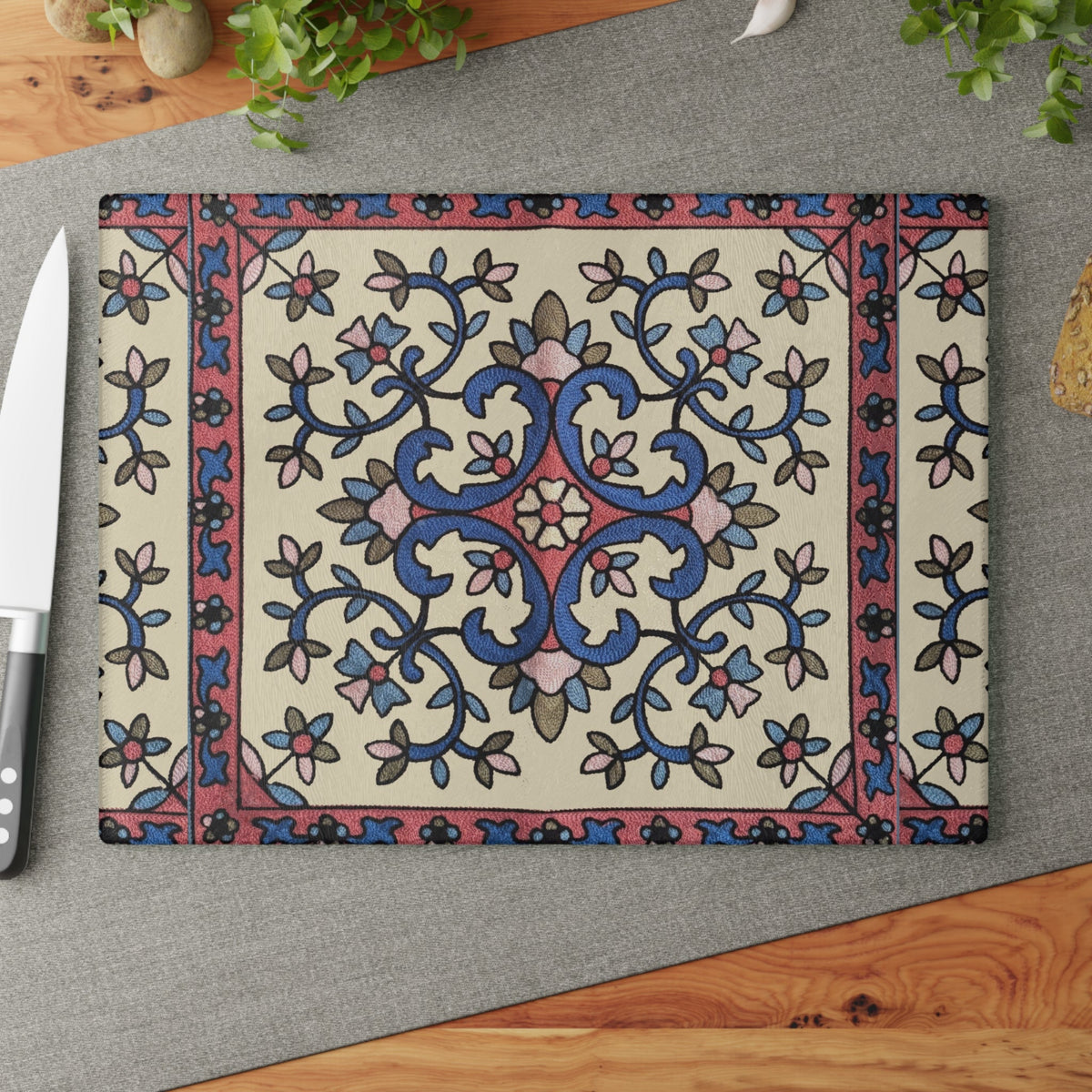 Armenian floral cutting board with a blue and pink vine on a cream ground