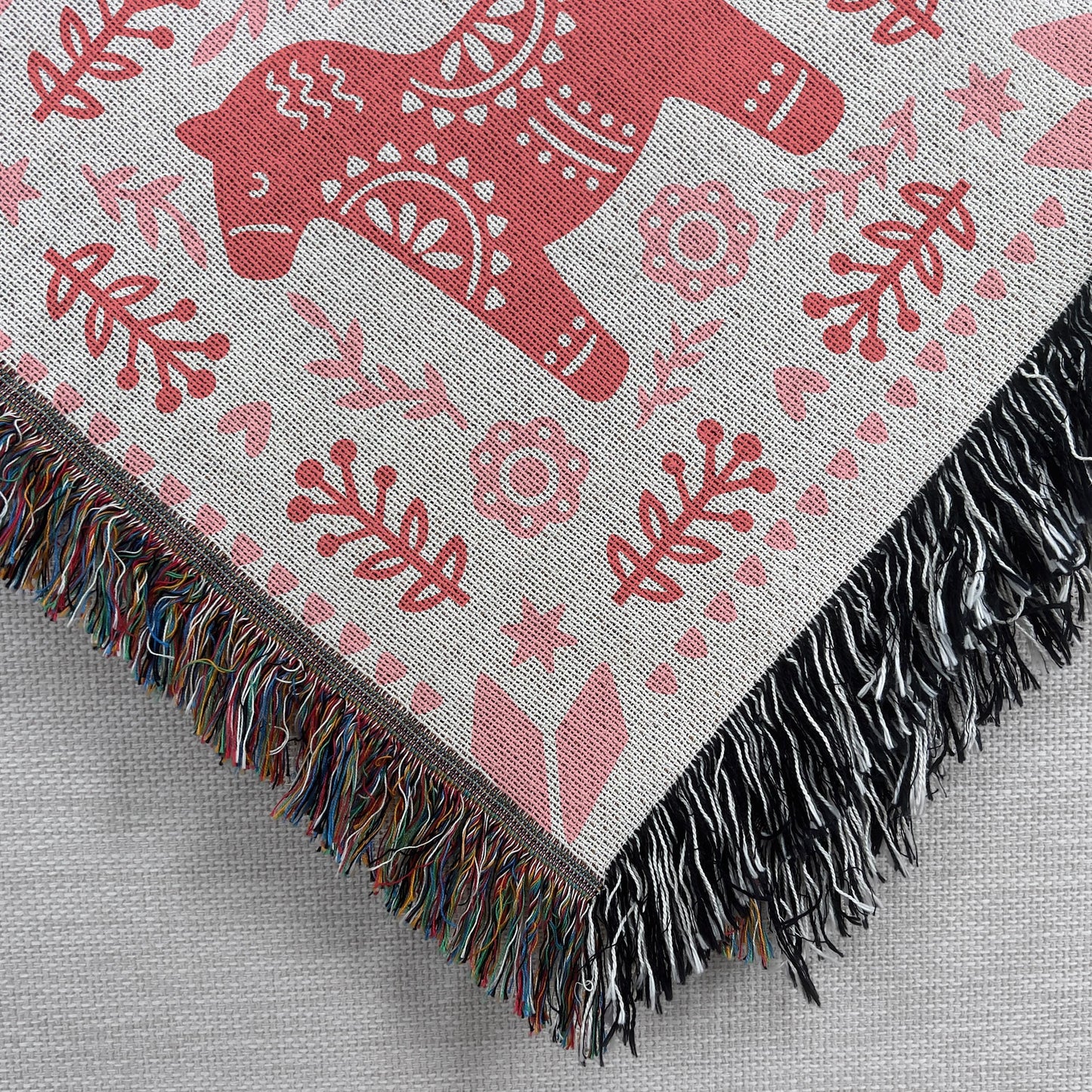 Scandinavian Inspired woven blanket with woven pattern styled for layered home decor