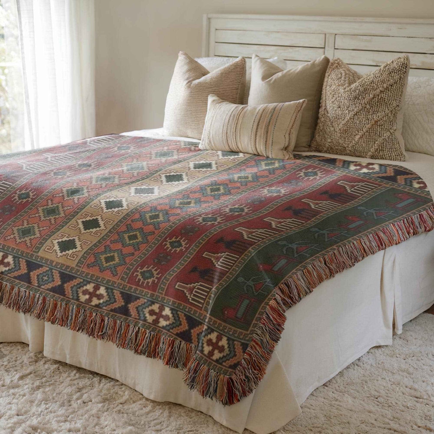 Anatolian Inspired woven blanket with rug-style pattern styled for layered home decor
