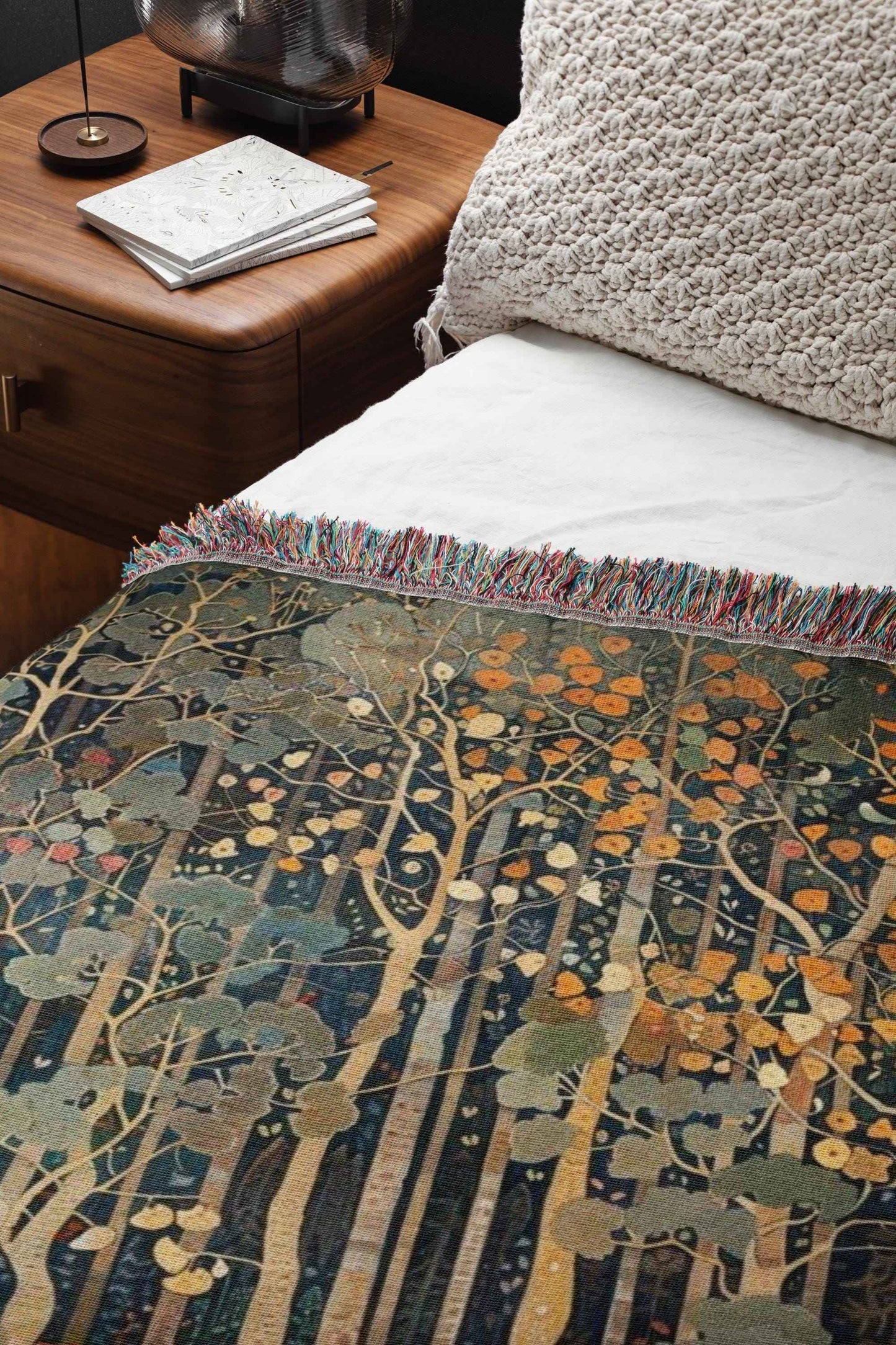 Scandinavian Inspired woven blanket with rug-style pattern styled for layered home decor