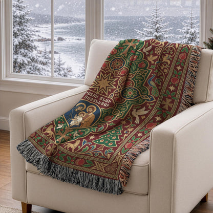 A cozy armchair with a vibrant, patterned blanket draped over it, positioned in front of a window overlooking a snowy landscape.