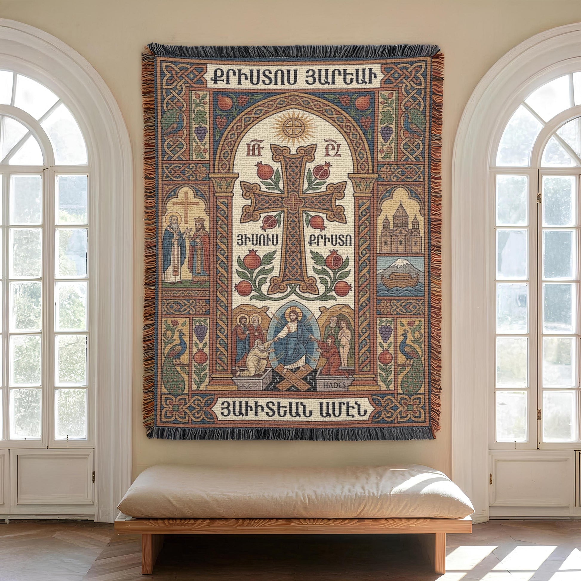 Sunlit arched window, textured Armenian Christian wall tapestry with fringed edges and script