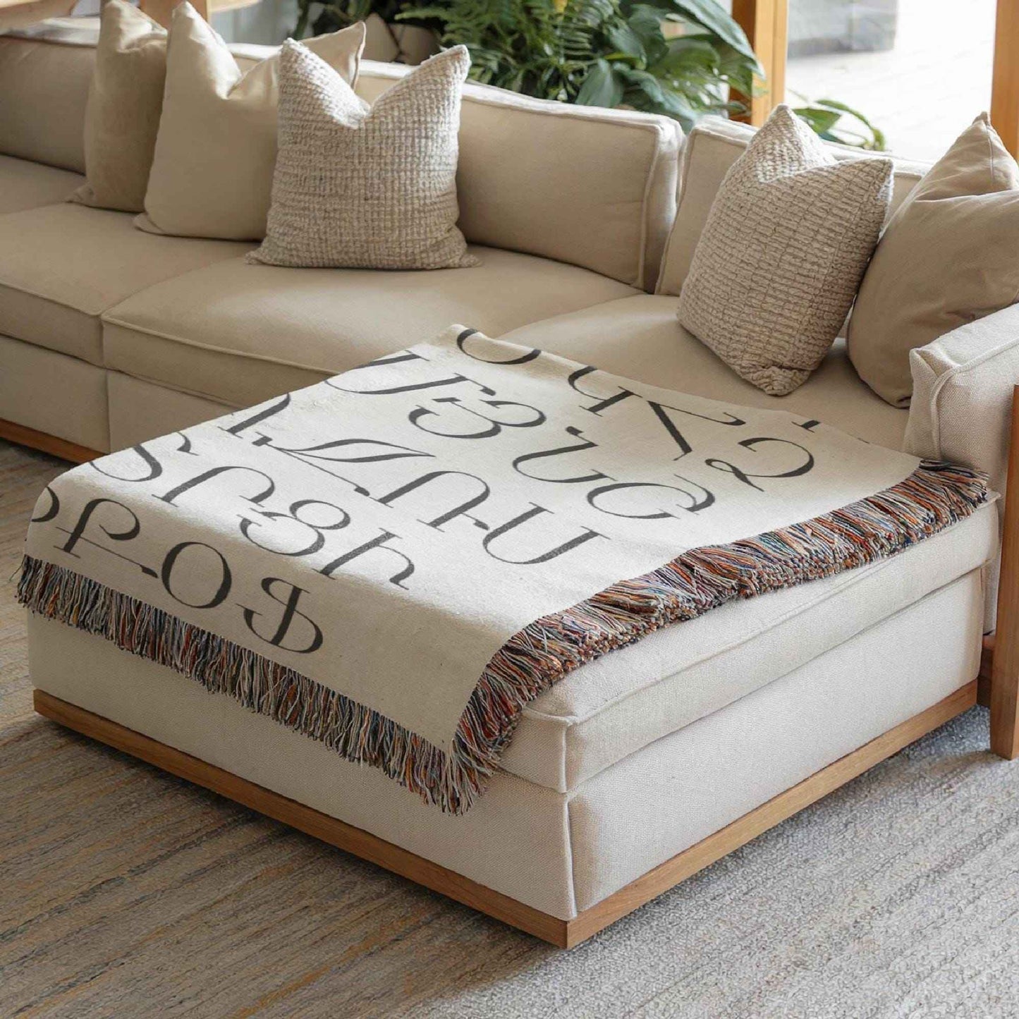 Boho woven blanket with woven pattern styled for layered home decor
