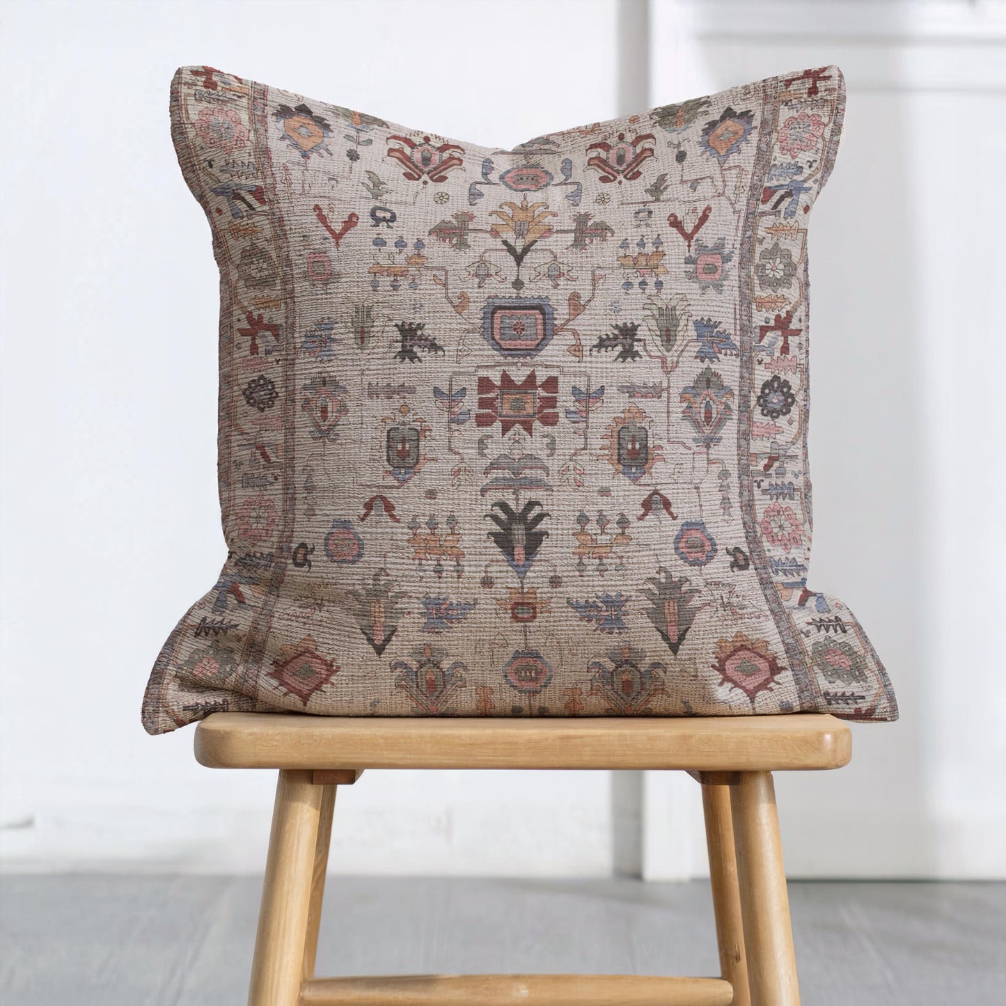 Anatolian Inspired pillow cover with rug-style pattern styled on a sofa or bed