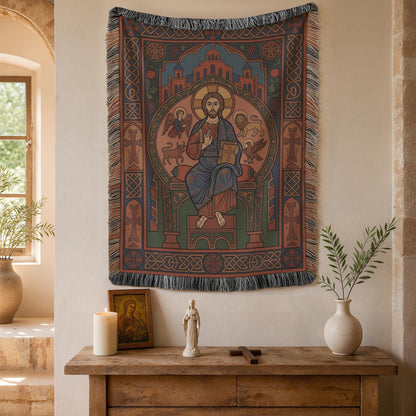 Christ Pantocrator tapestry above a wooden console with a candle and a ceramic vase