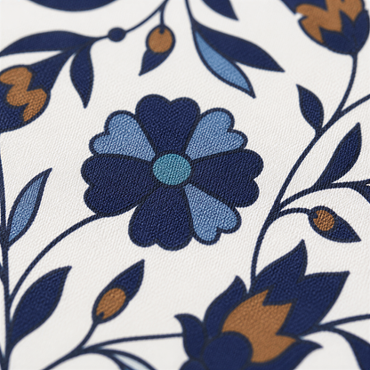 Close view of the fine blue and rust flowering vines on white