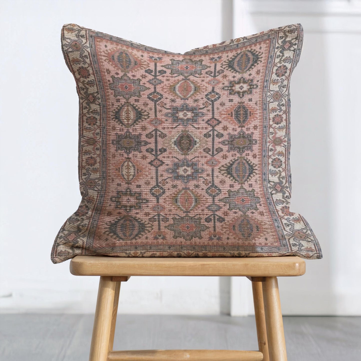 Anatolian Inspired throw pillow with rug-style pattern styled on a sofa or bed