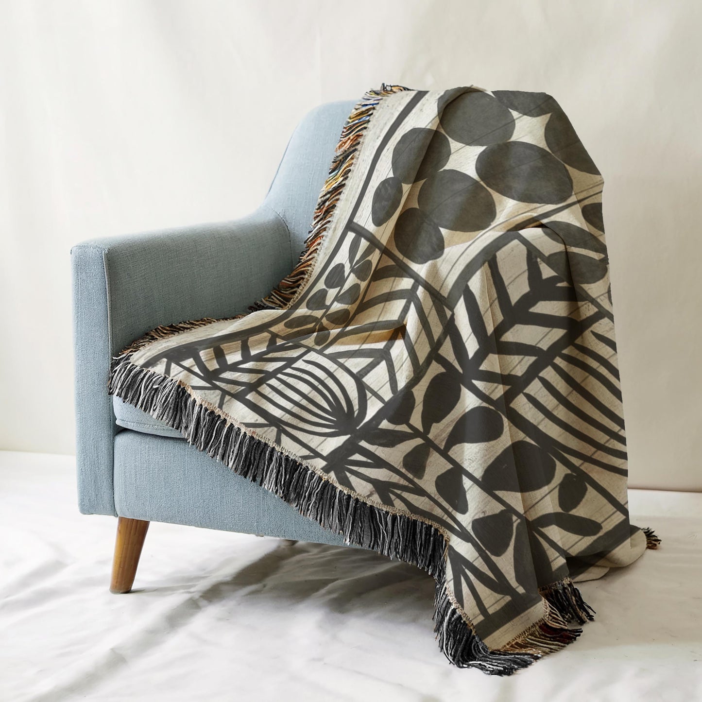 Modern Geometric woven blanket with geometric pattern styled for layered home decor