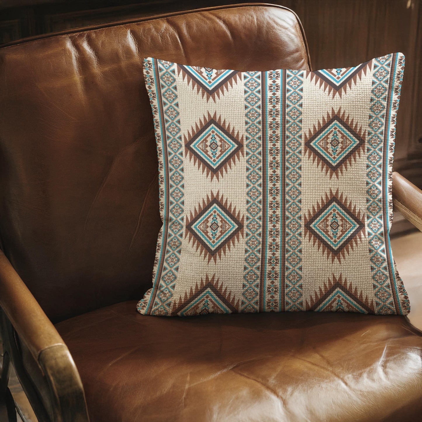 Southwestern throw pillow with geometric pattern styled on a sofa or bed