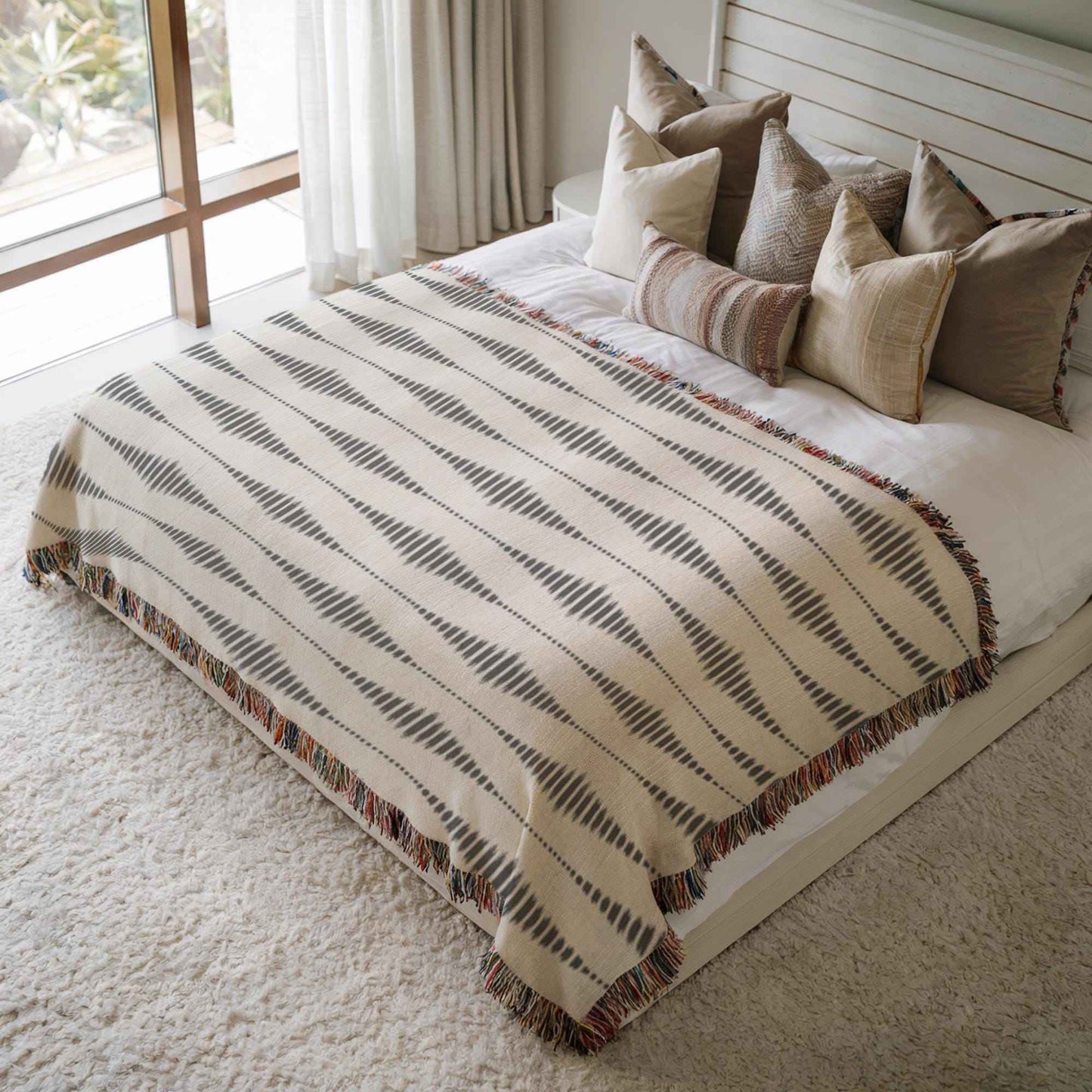 Modern Geometric woven blanket with geometric pattern styled for layered home decor
