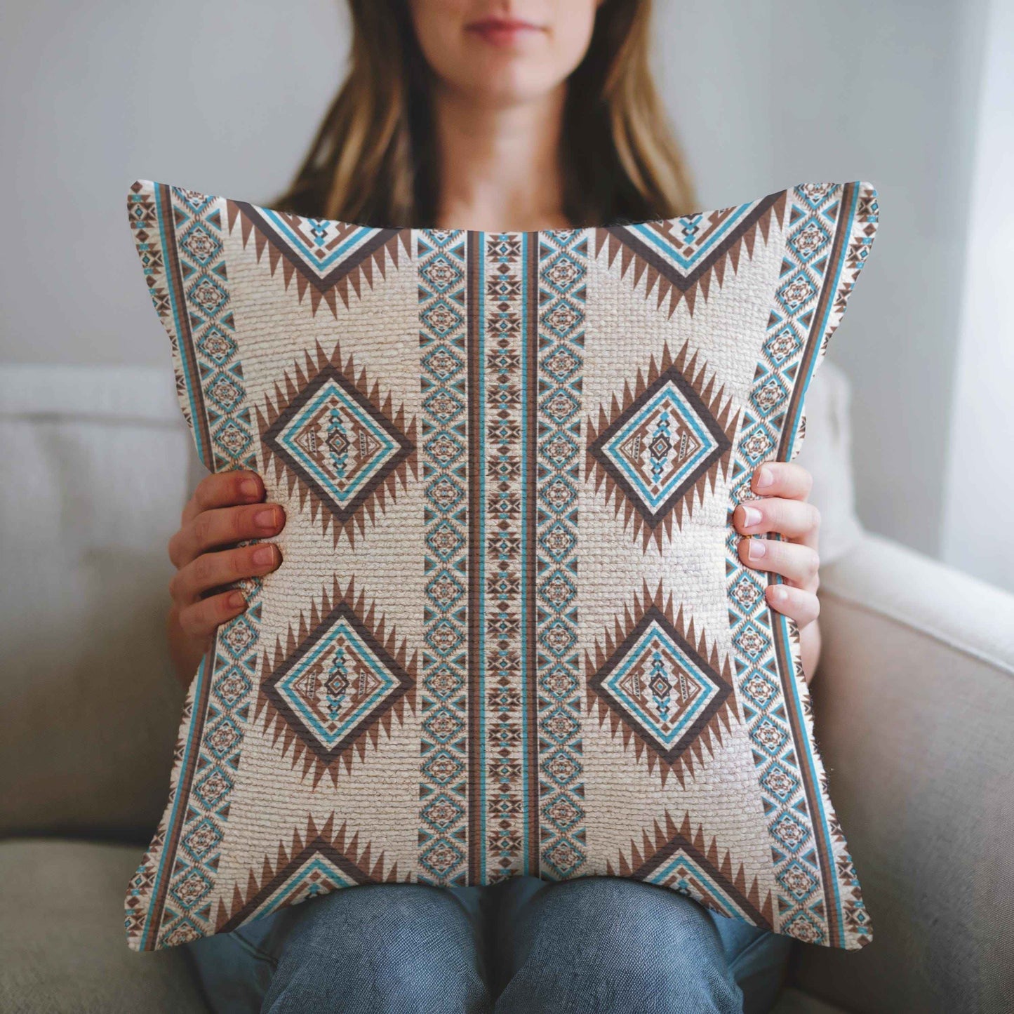 Southwestern throw pillow with geometric pattern styled on a sofa or bed