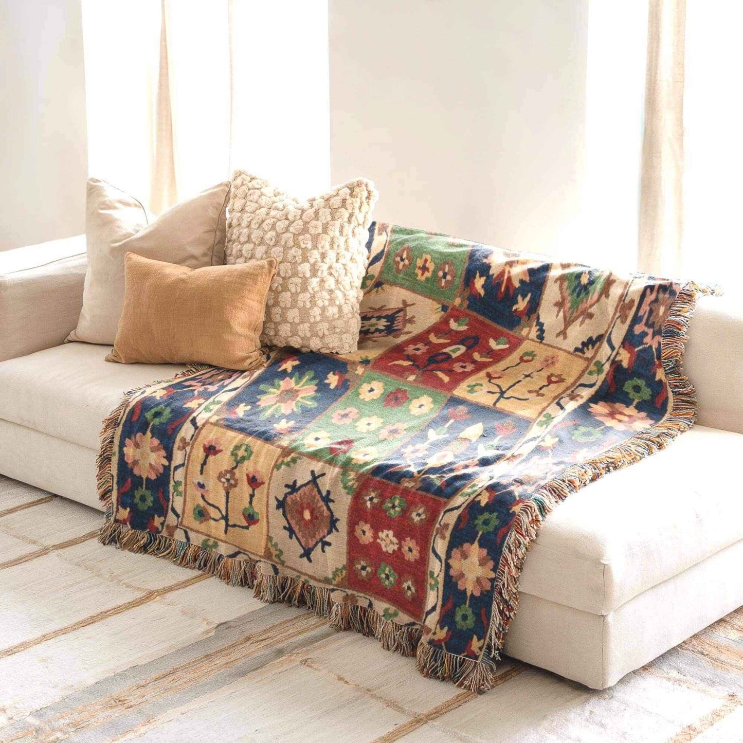 Anatolian Inspired woven blanket with floral pattern styled for layered home decor