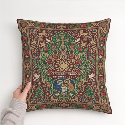 A hand is holding a decorative pillow with an intricate, colorful design featuring various religious and ornamental elements, such as crosses, stars, and floral patterns.