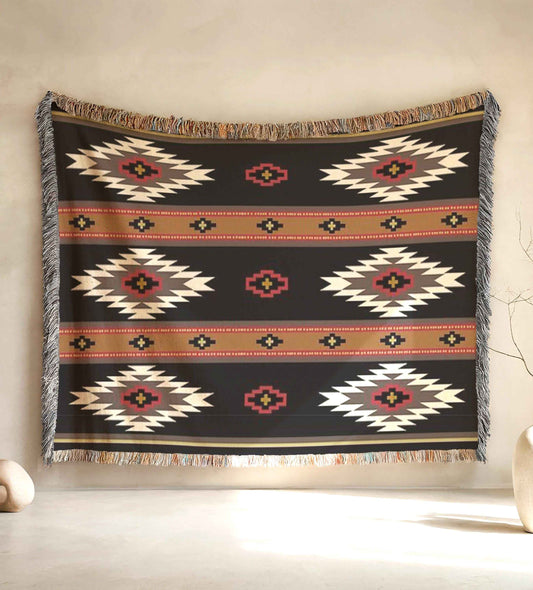 Southwestern woven blanket with geometric pattern styled for layered home decor