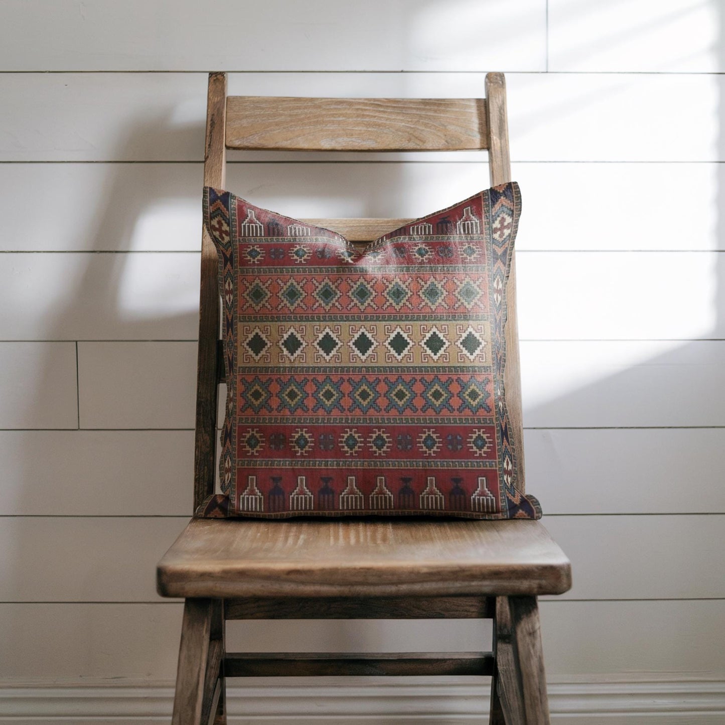 Anatolian Inspired pillow cover with rug-style pattern styled on a sofa or bed