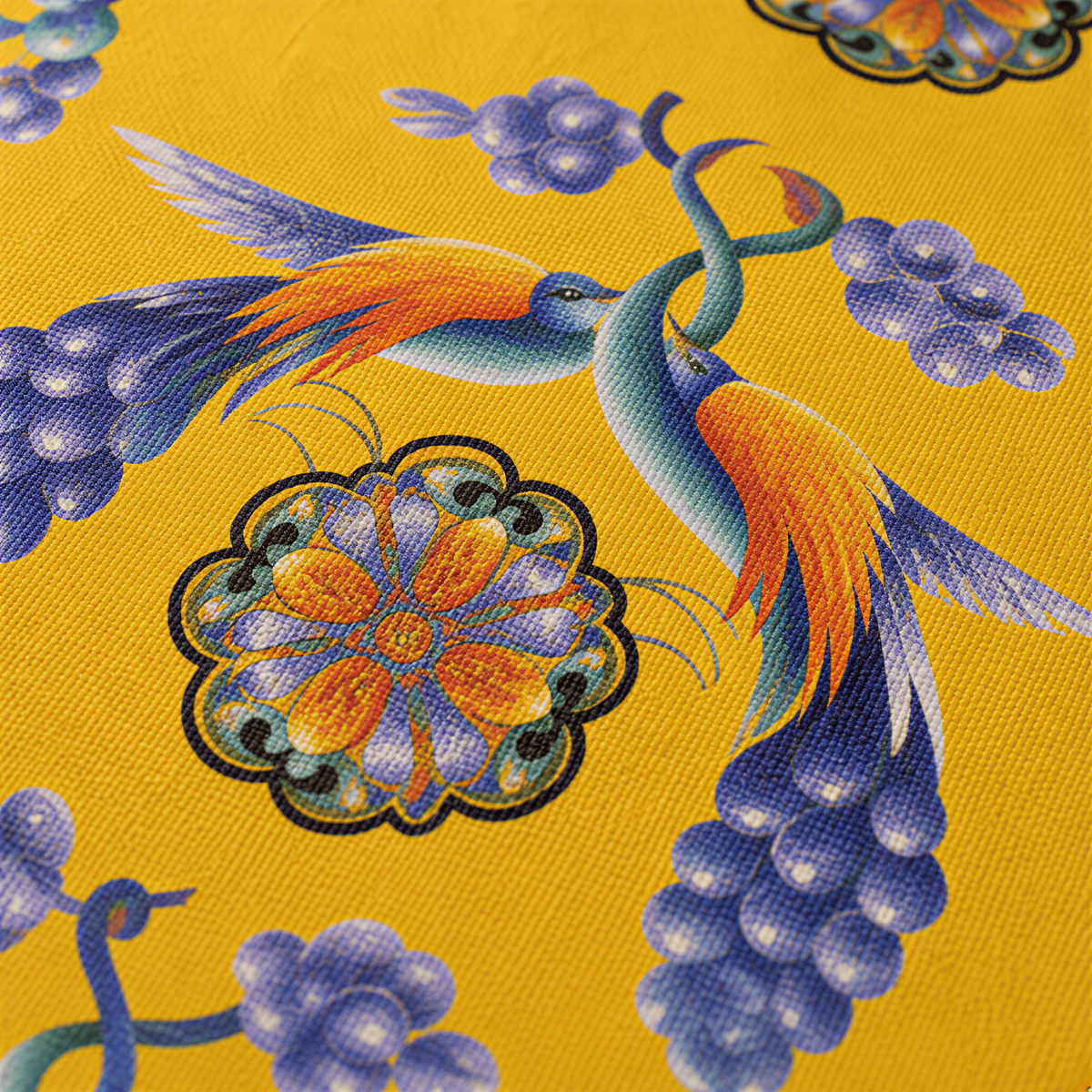 Close view of the lavender birds and orange rosettes on the yellow ground