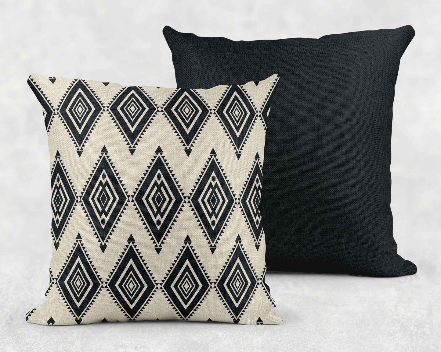 Southwestern throw pillow with geometric pattern styled on a sofa or bed