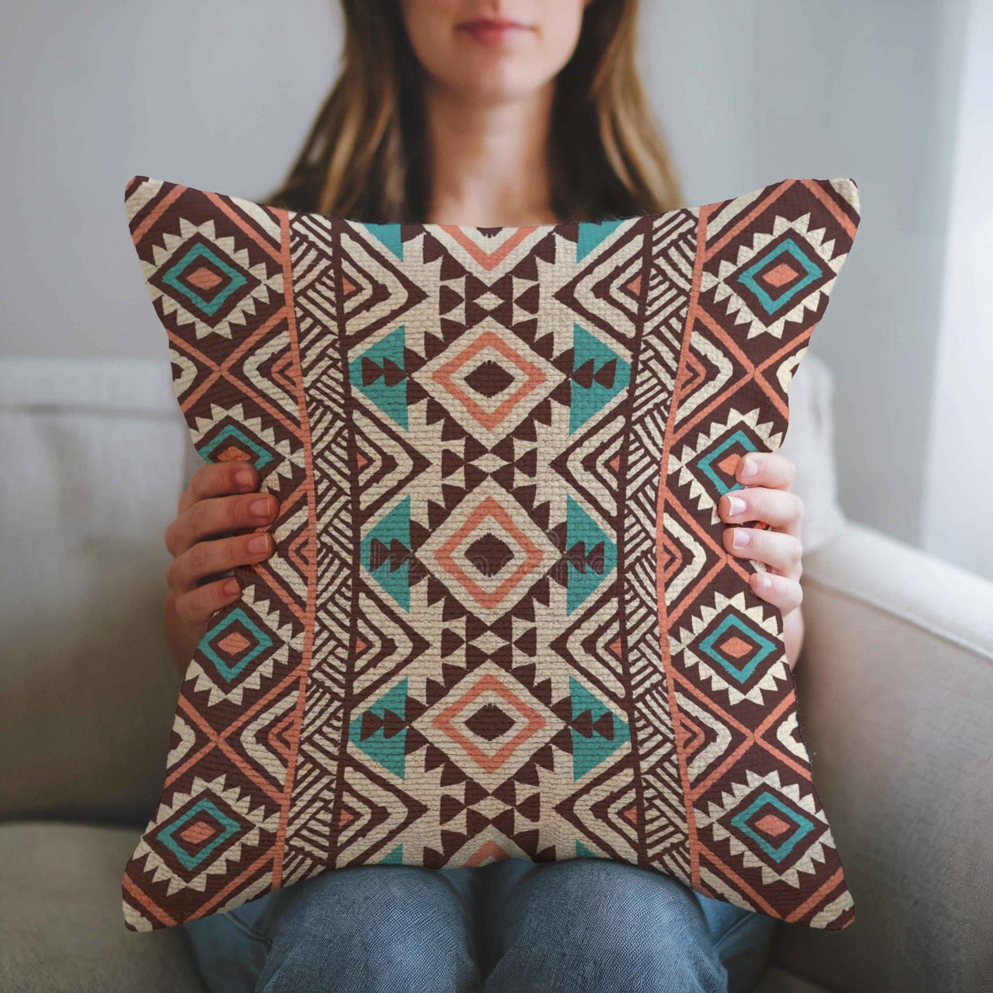 Southwestern pillow cover with geometric pattern styled on a sofa or bed