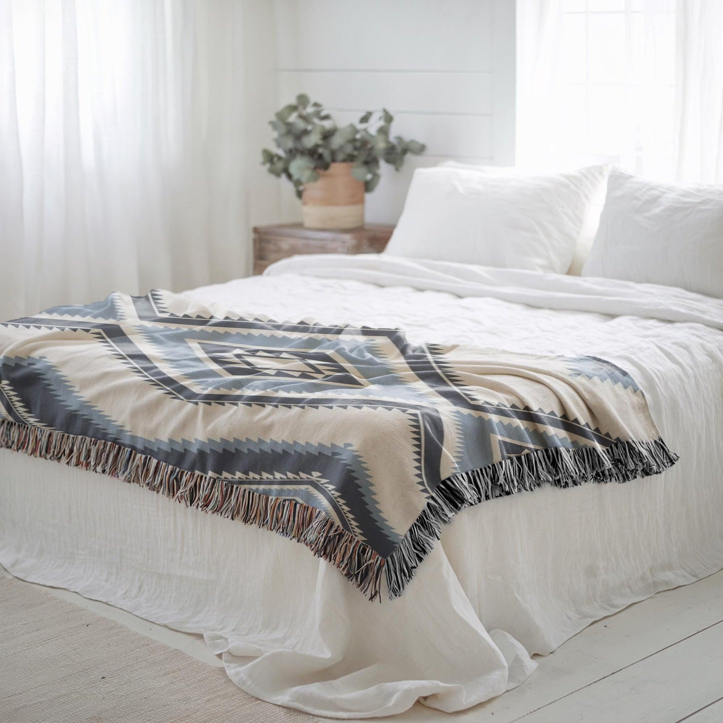 Southwestern woven blanket with geometric pattern styled for layered home decor