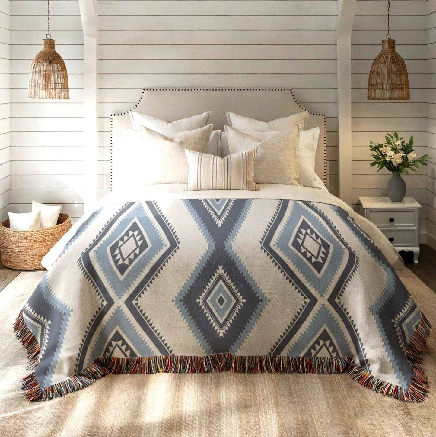 Southwestern woven blanket with geometric pattern styled for layered home decor