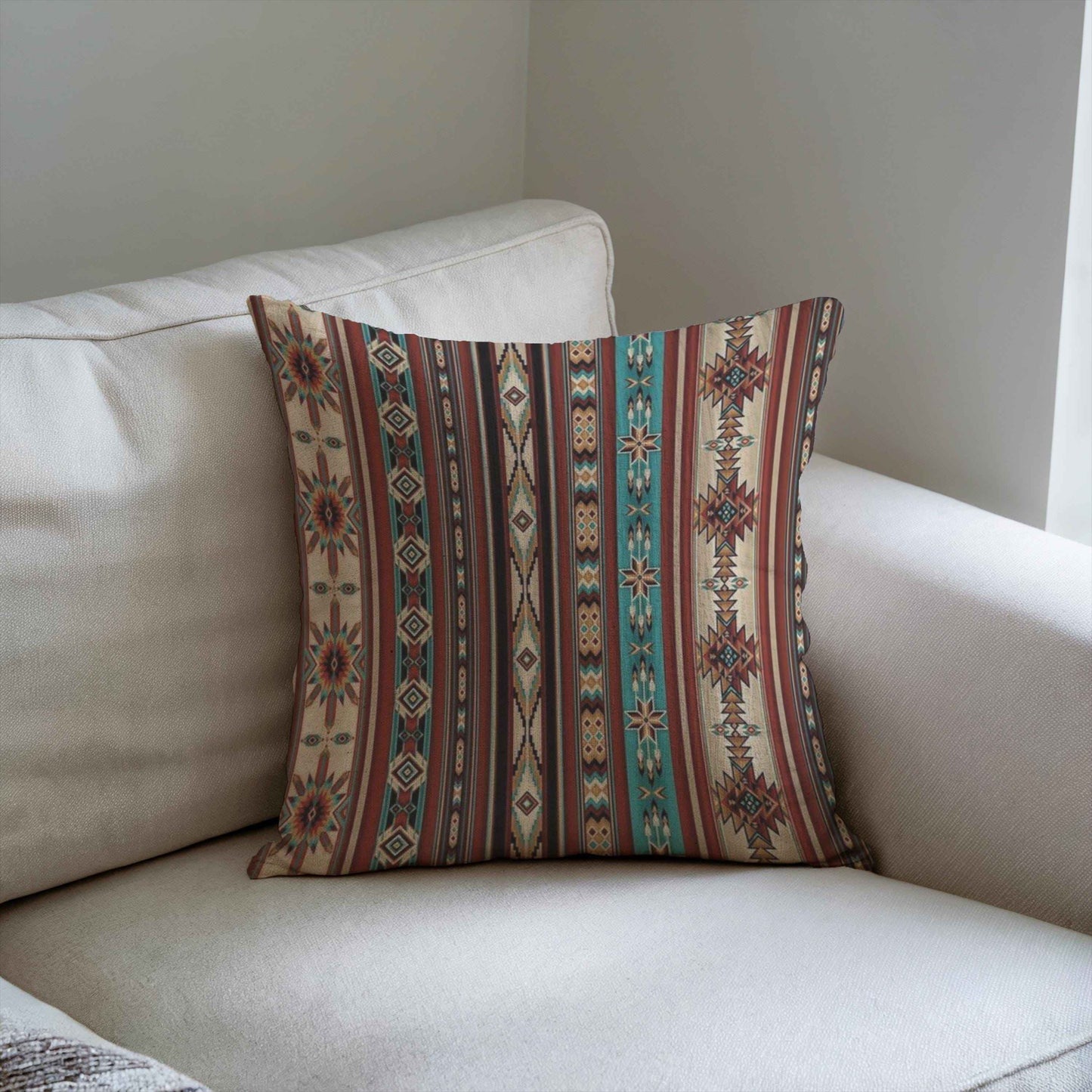 Southwestern throw pillow with geometric pattern styled on a sofa or bed