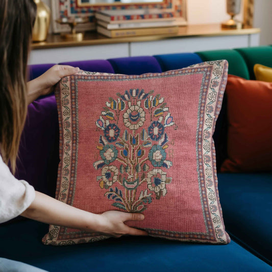 Anatolian Inspired throw pillow with floral pattern styled on a sofa or bed