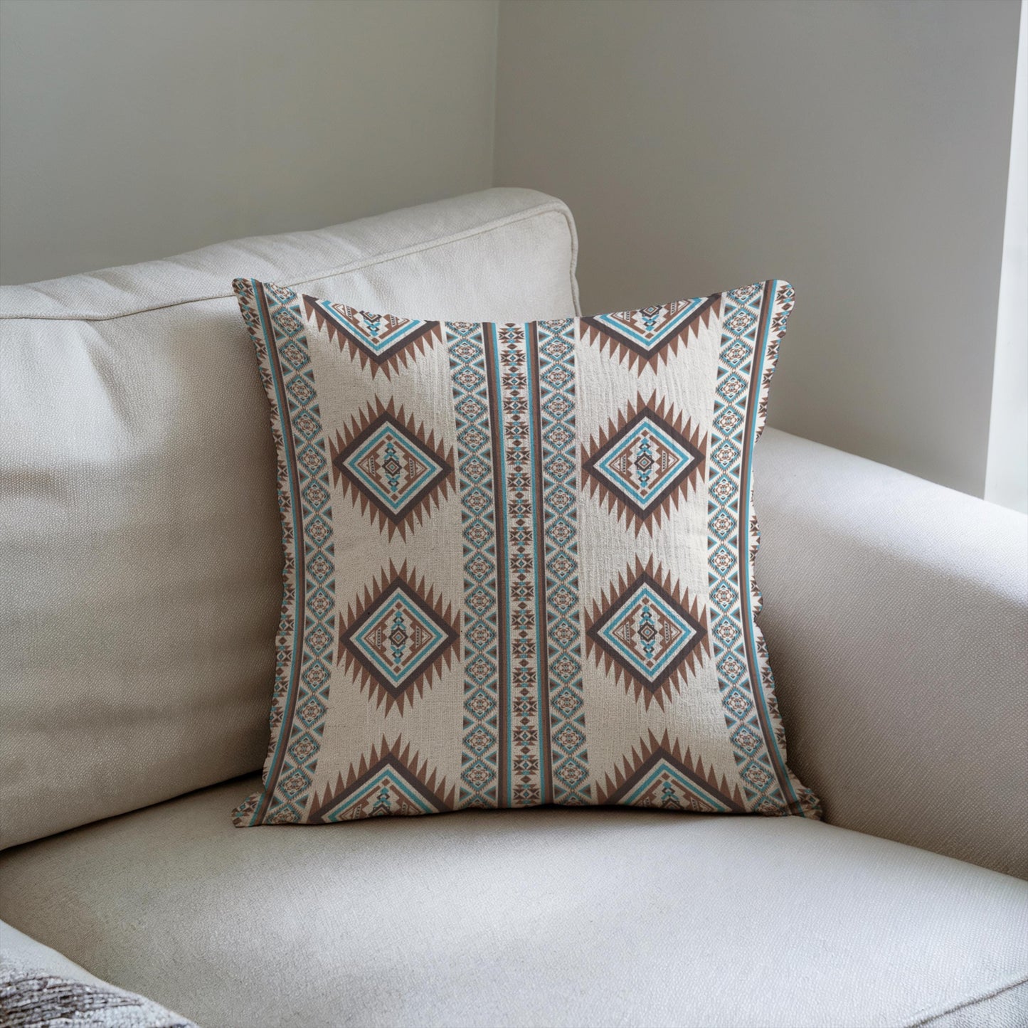 Southwestern throw pillow with geometric pattern styled on a sofa or bed