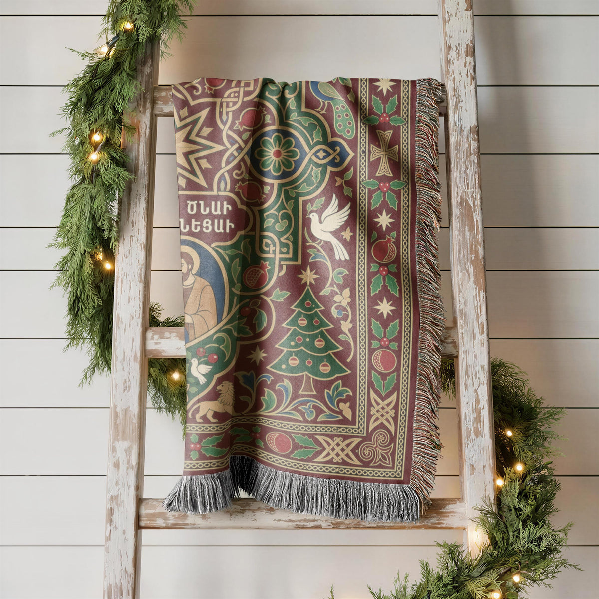 Armenian Nativity star and dove woven blanket hanging on a wooden ladder against a white wall