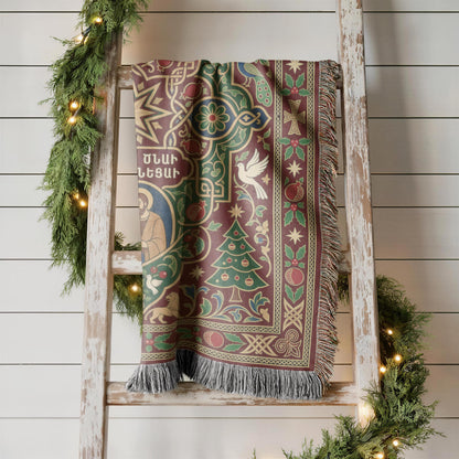 Armenian Nativity star and dove woven blanket hanging on a wooden ladder against a white wall