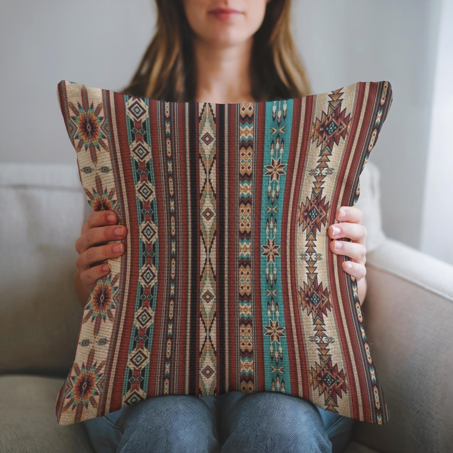 Southwestern throw pillow with geometric pattern styled on a sofa or bed