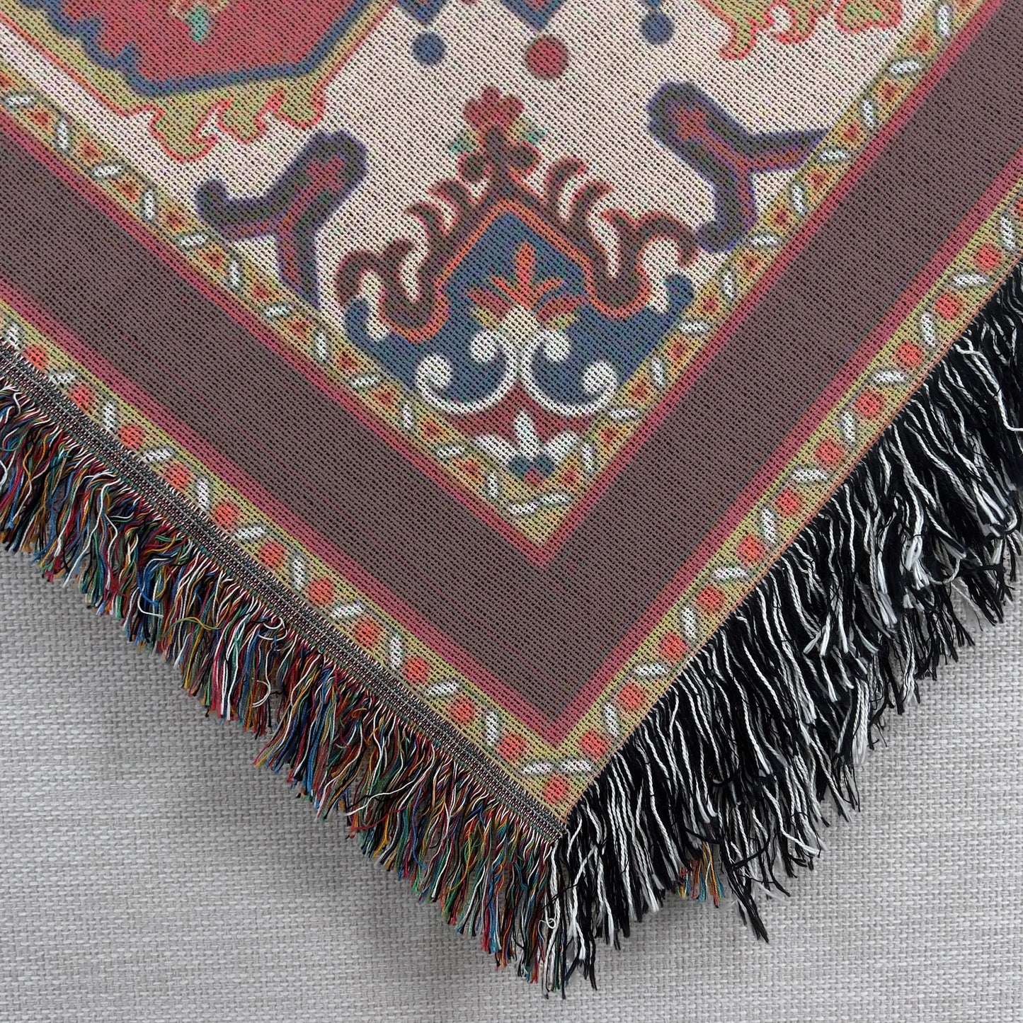 Moroccan Inspired woven blanket with rug-style pattern styled for layered home decor