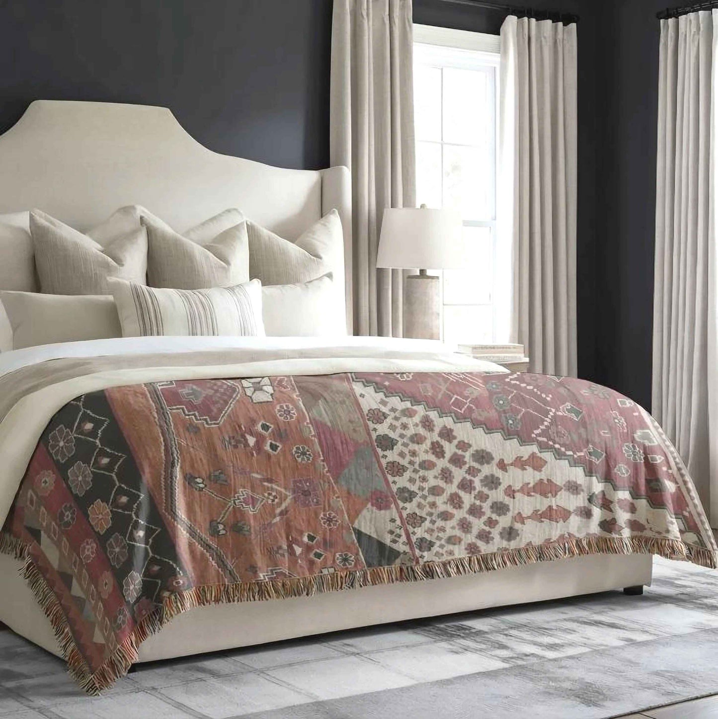 Southwestern woven blanket with geometric pattern styled for layered home decor