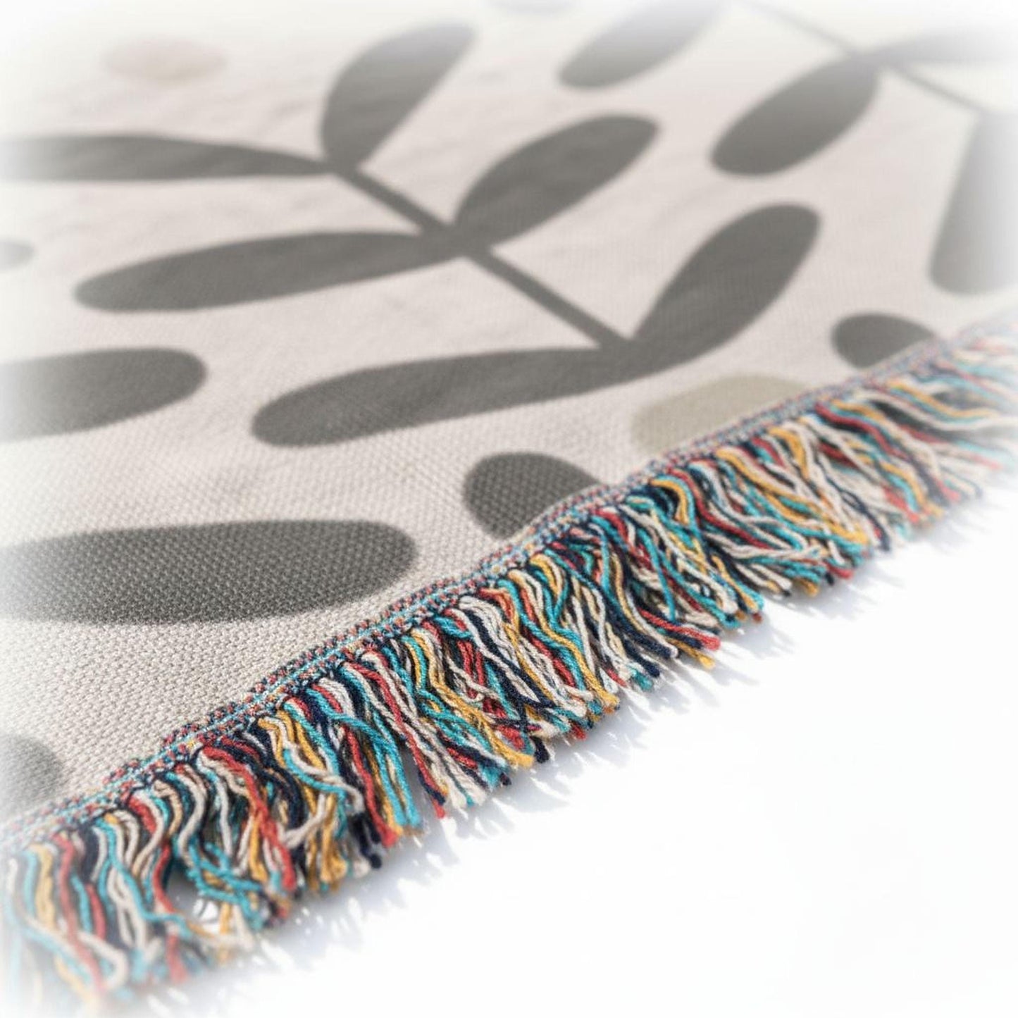 Scandinavian Inspired woven blanket with woven pattern styled for layered home decor