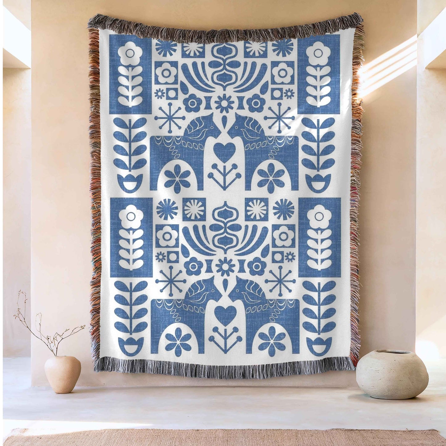 Scandinavian Inspired woven blanket with rug-style pattern styled for layered home decor