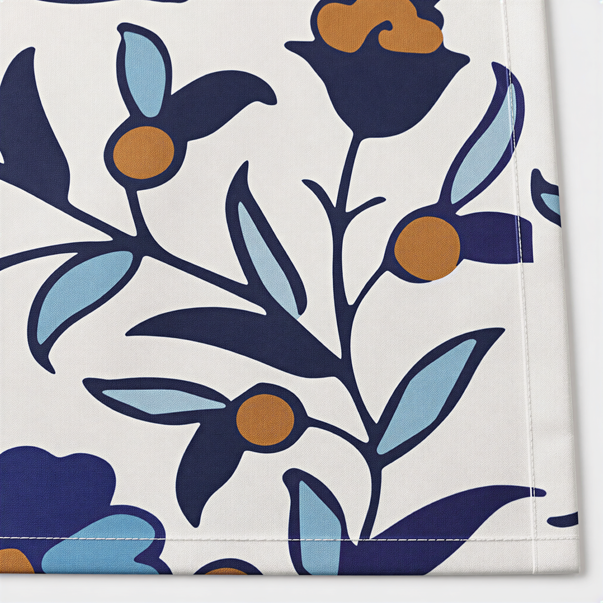 Close view of the large navy poppies and olive leaves on cream