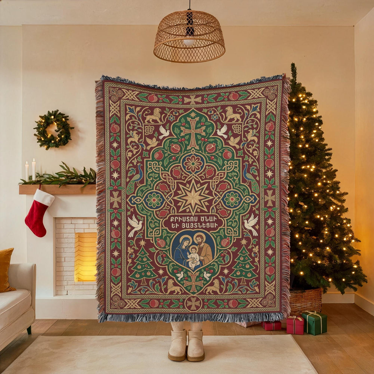 A person stands in front of a Christmas tree, holding a large, ornate, and colorful blanket with a star design.