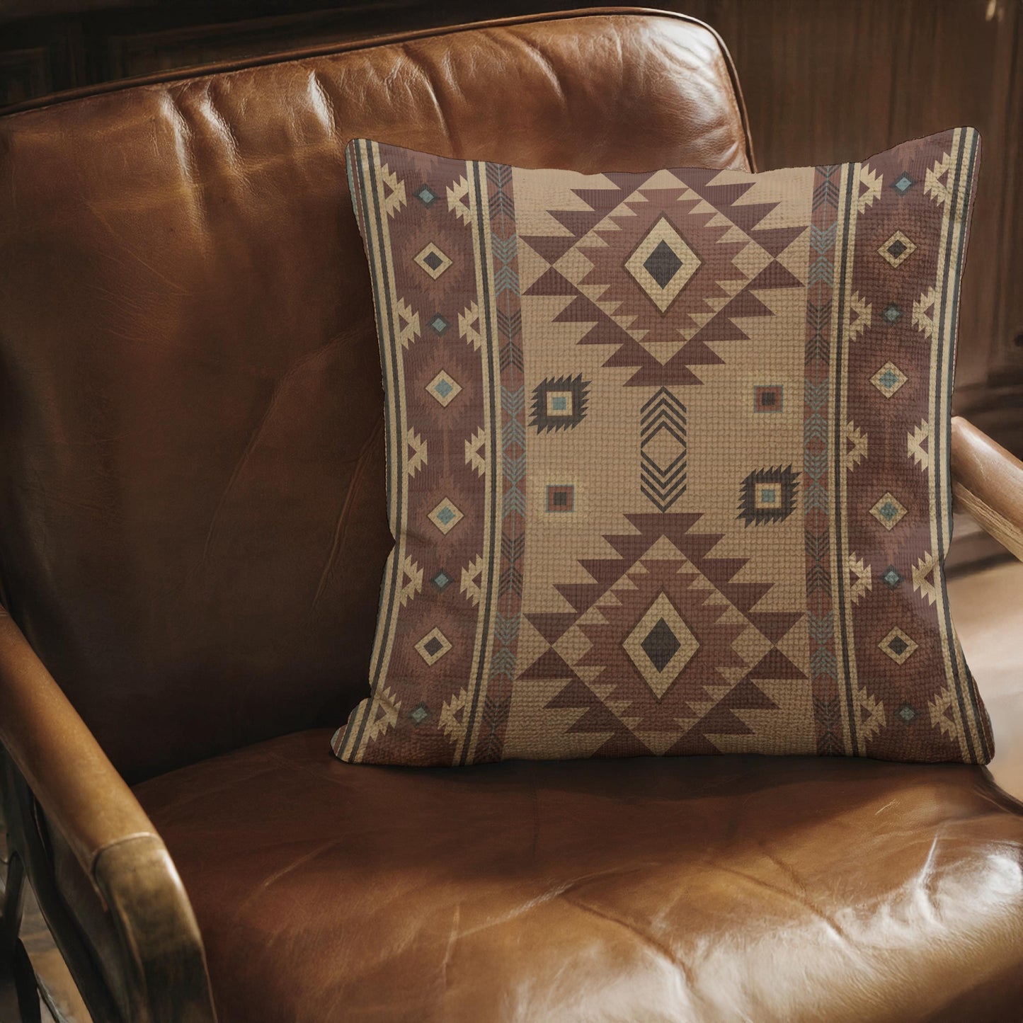 Southwestern throw pillow with geometric pattern styled on a sofa or bed
