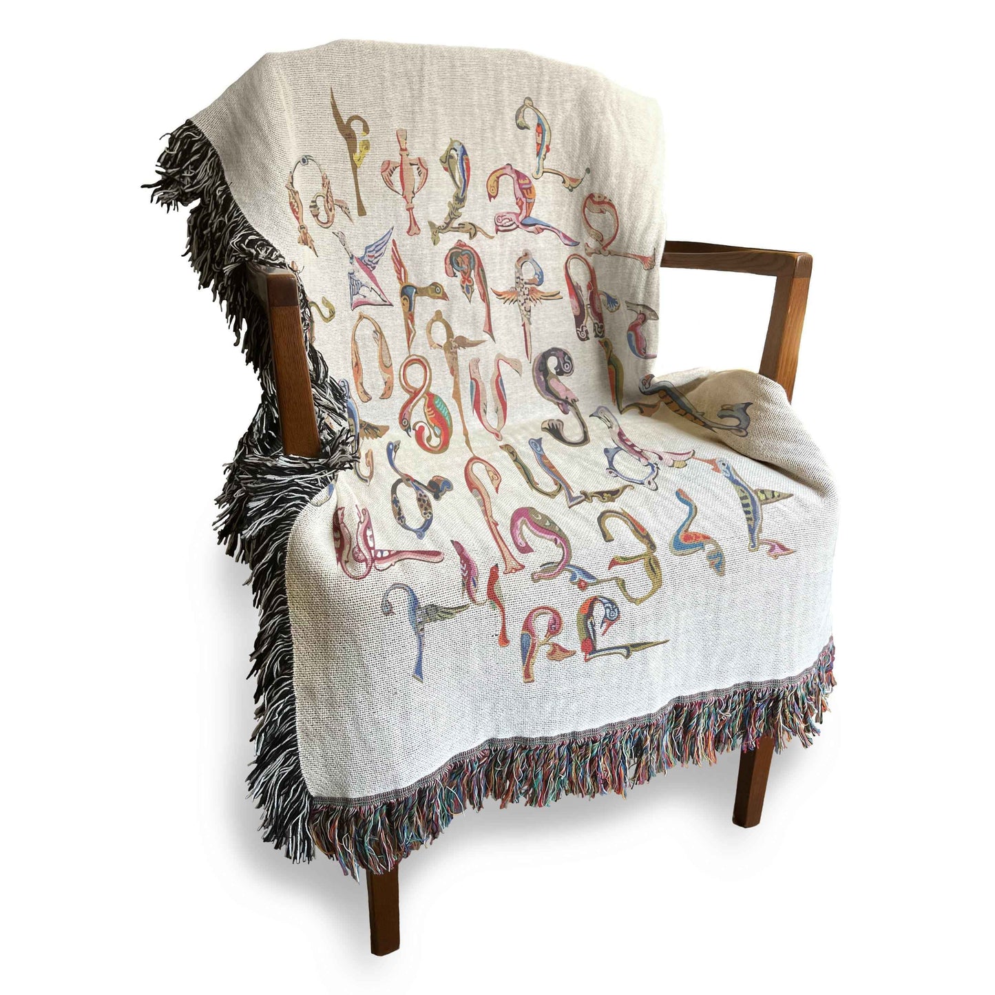 Boho woven blanket with woven pattern styled for layered home decor