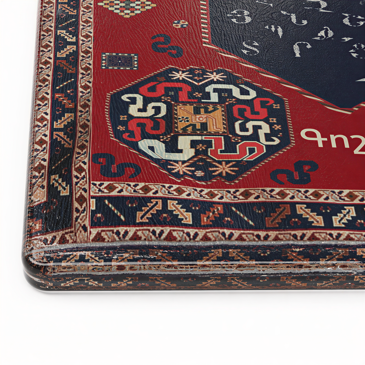Close view of the navy octagon of Armenian letters inside the red carpet border