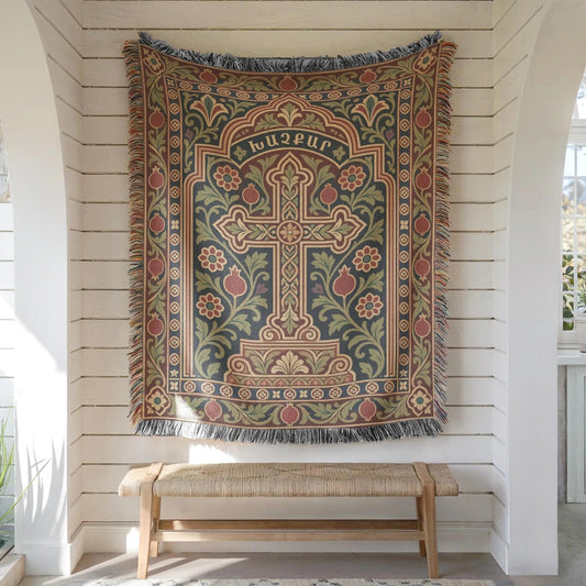 Khachkar cross tapestry in a pointed arch hung on white shiplap above a wooden bench